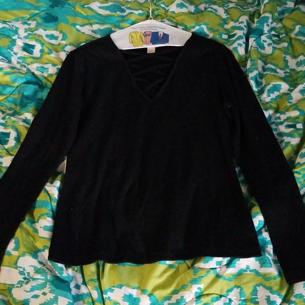 A large, long-sleeve, plain black V-neck